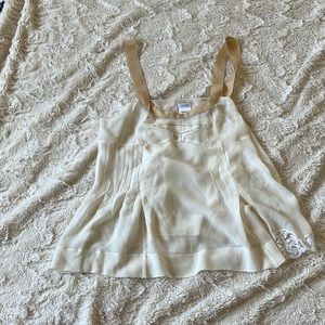 Sleeveless Cream Silk Blouse by Tufi Duek Laced Left side  Pleated Right Side